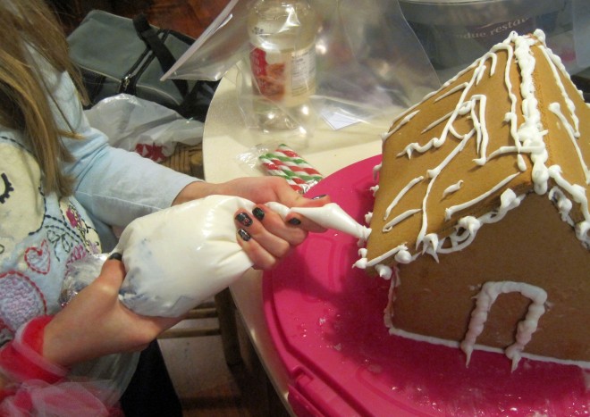Princess Buttercup decorates her gingerbread house.